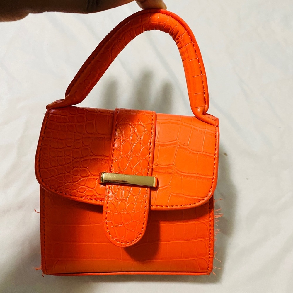 Orange mini handbag with gold chain strap